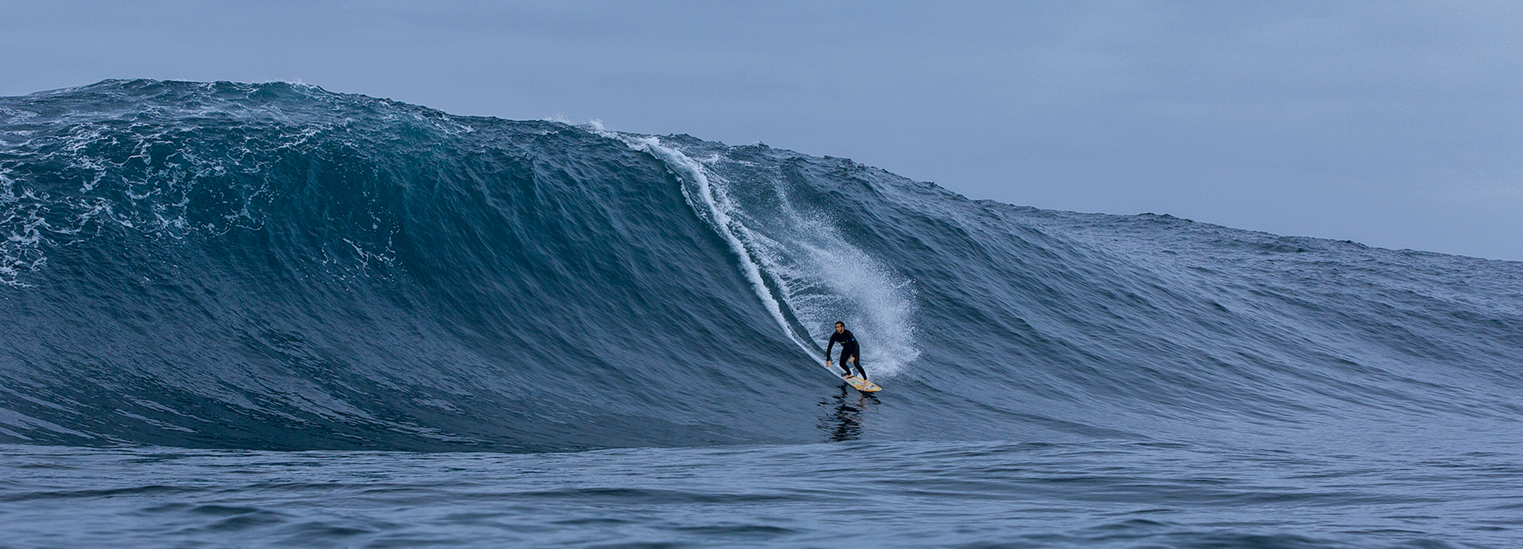Gif of man catching wave